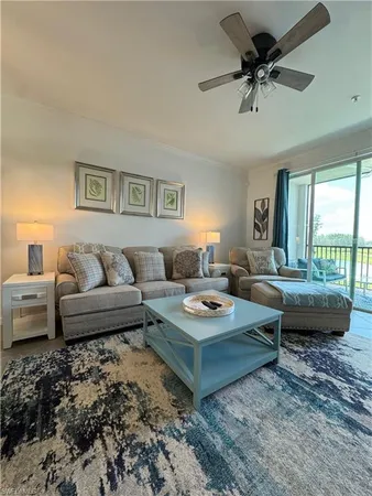 a living room with furniture and a rug