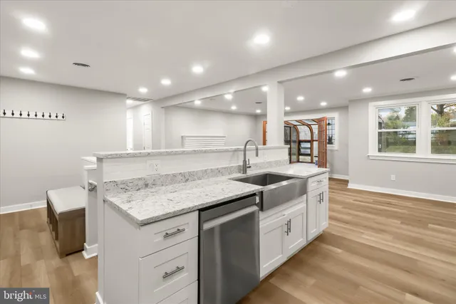 a view of an empty room with glass door and chair