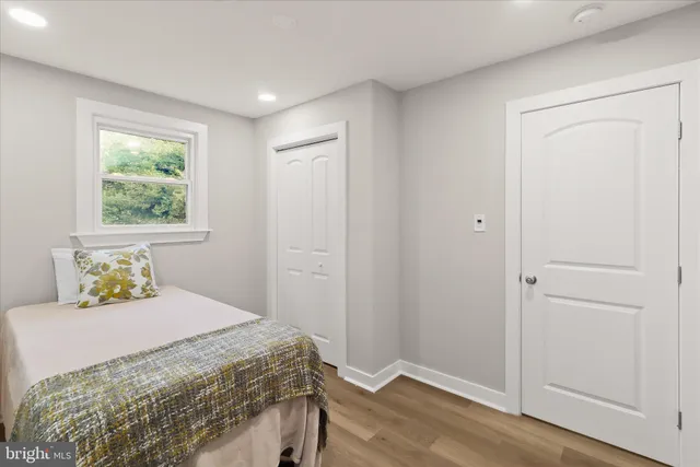 a bathroom with a sink toilet and mirror
