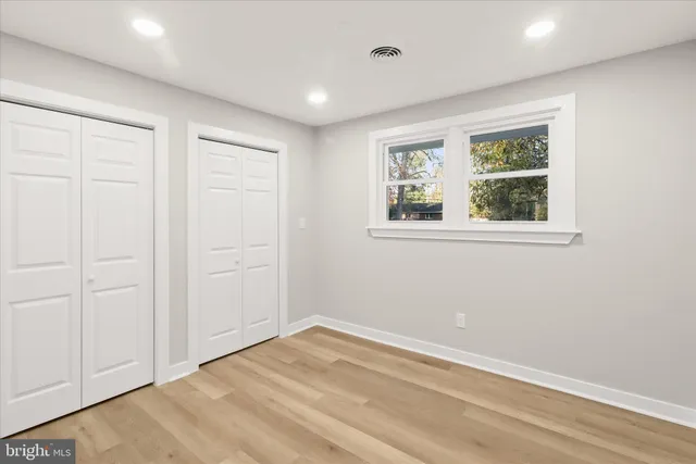 a bathroom with a bath tub with a shower