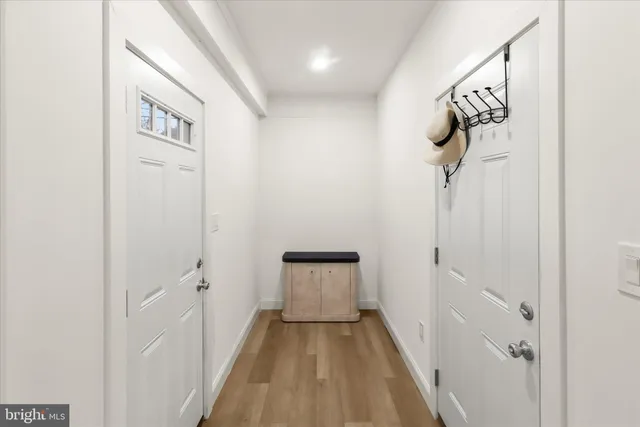 a kitchen with a sink a stove and cabinets