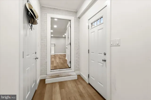 a kitchen with stainless steel appliances a refrigerator sink and microwave