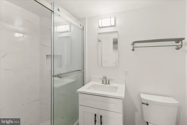 a view of a house with trees in the background