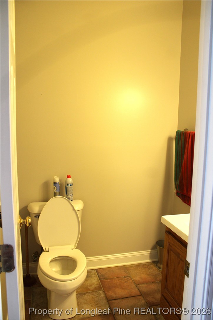 573 Porter Road Hope Mills, NC 28348 - Photo 17 of 29 a bathroom with a toilet and a sink