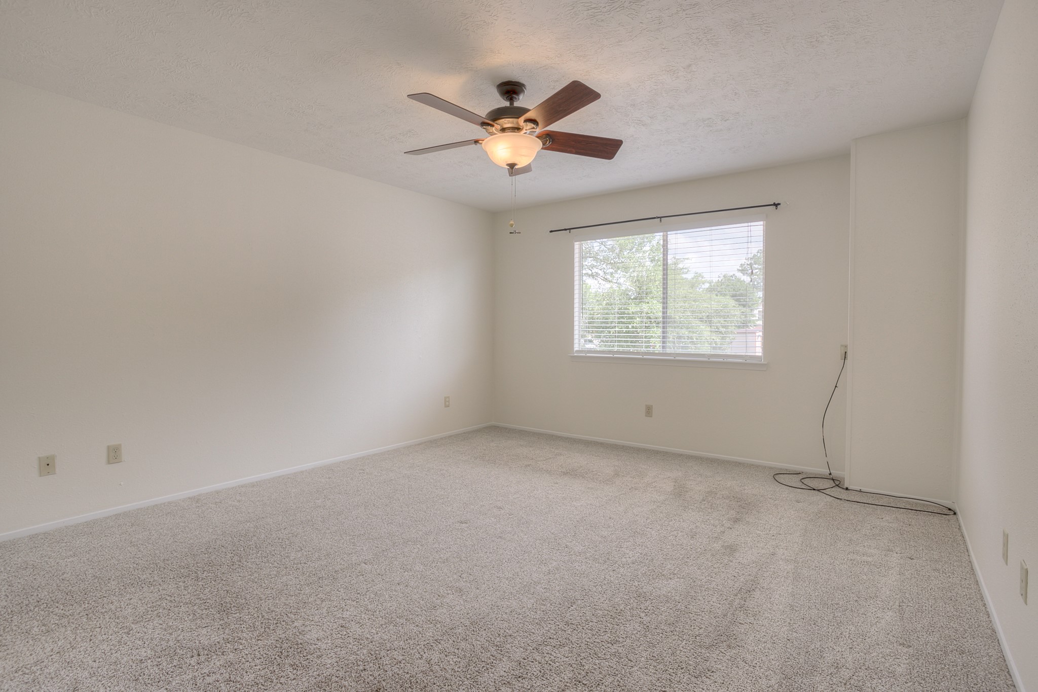 287 Broadmoor Street Trinity, TX 75862 - Photo 18 of 36 First bedroom overlooks the back of the house