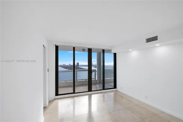 a view of an empty room with a window