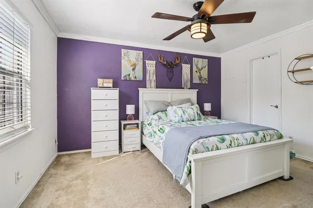 a bed room with a bed and a window