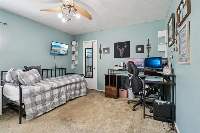 a bedroom with furniture and a window