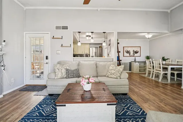a living room with furniture and a rug