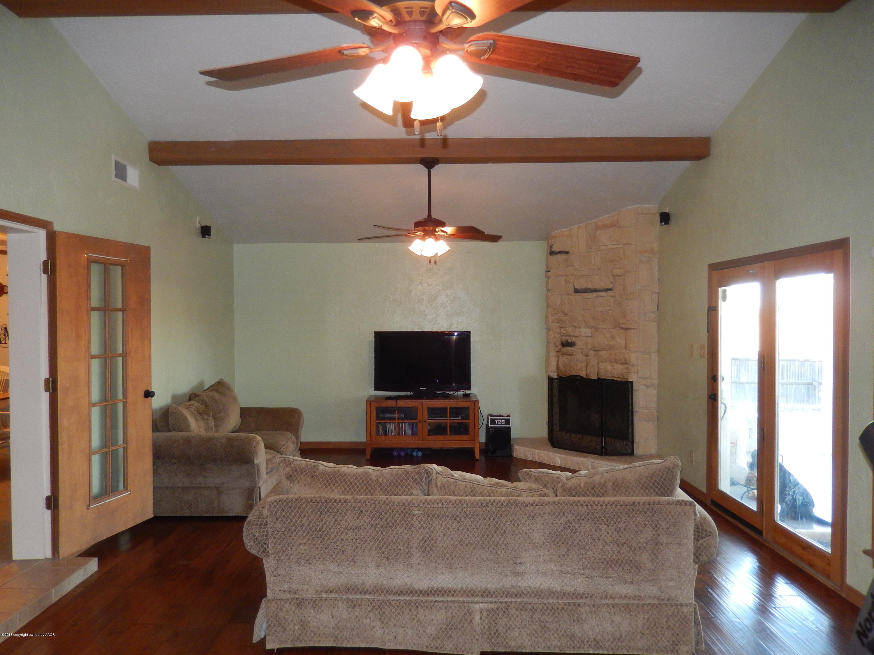 101 Rimrock Trail Amarillo, TX 79108 - Photo 12 of 33 Huge Den, Wood floors, Stone fireplace