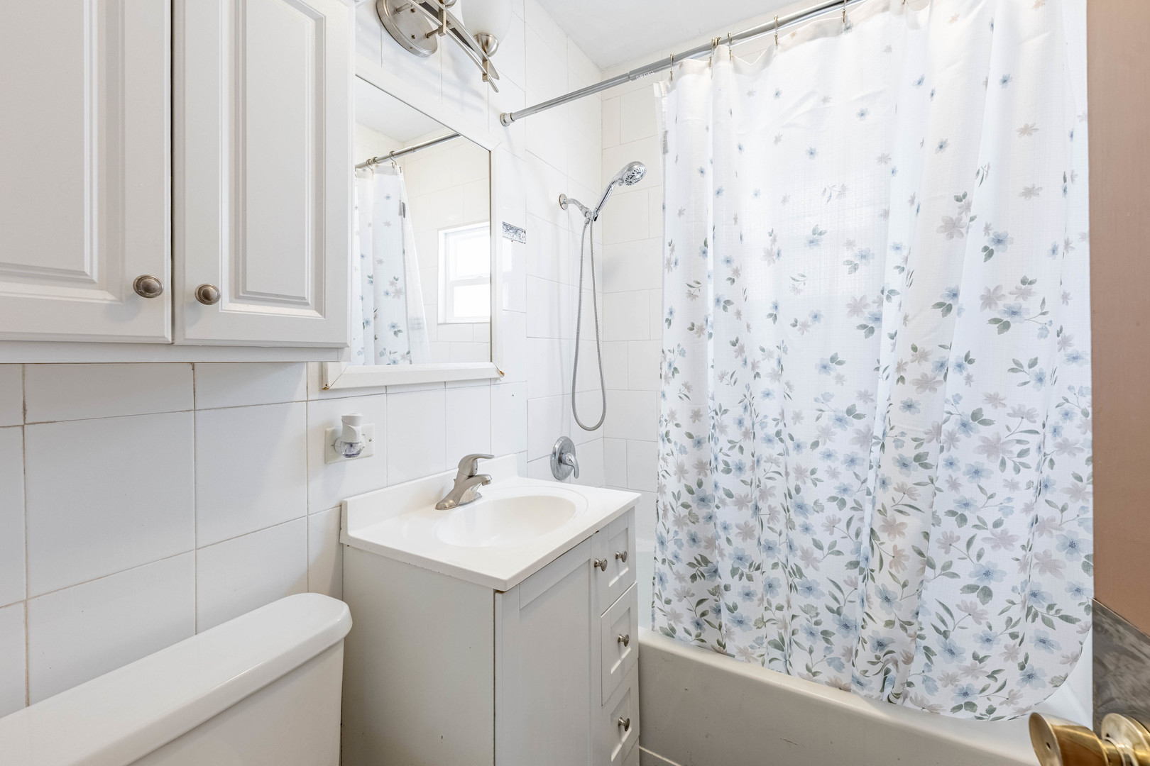 5026 West Addison Street Chicago, IL 60641 - Photo 14 of 34 a bathroom with a sink and a toilet