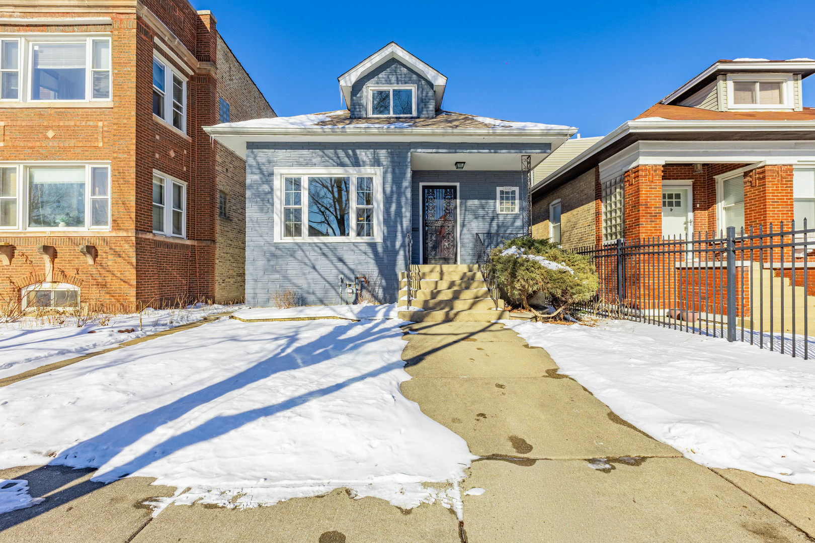 5026 West Addison Street Chicago, IL 60641 - Photo 2 of 34 a front view of a house