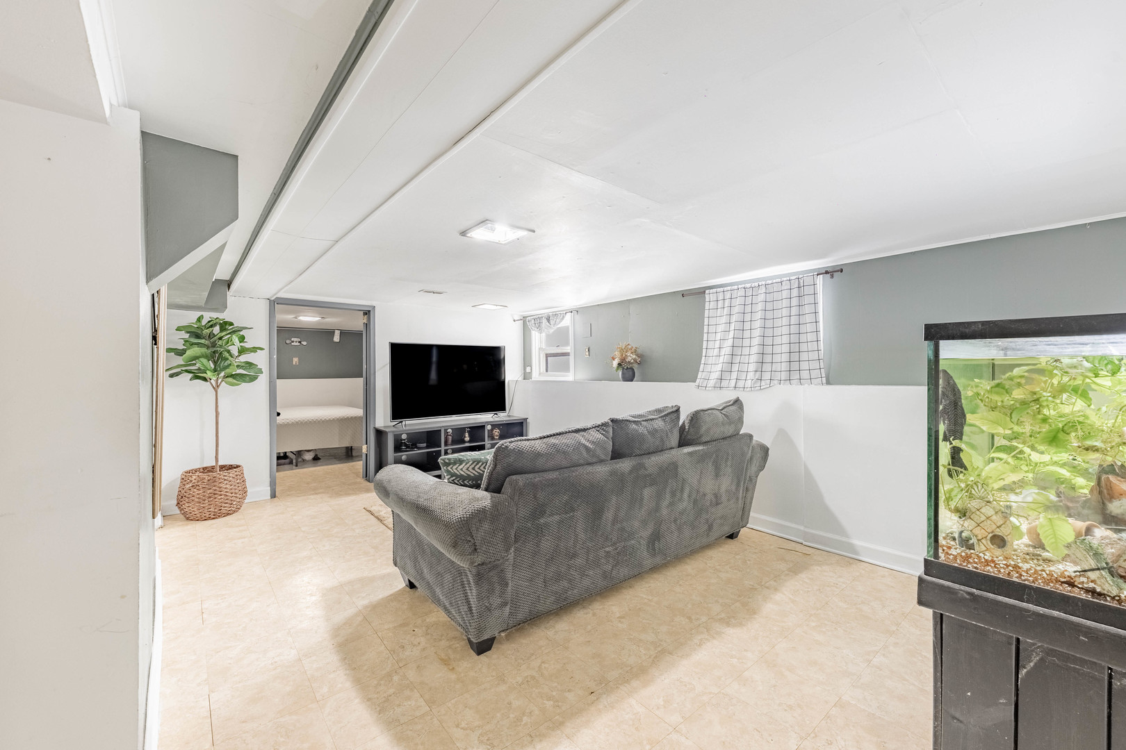 5026 West Addison Street Chicago, IL 60641 - Photo 24 of 34 a living room with furniture and a flat screen tv