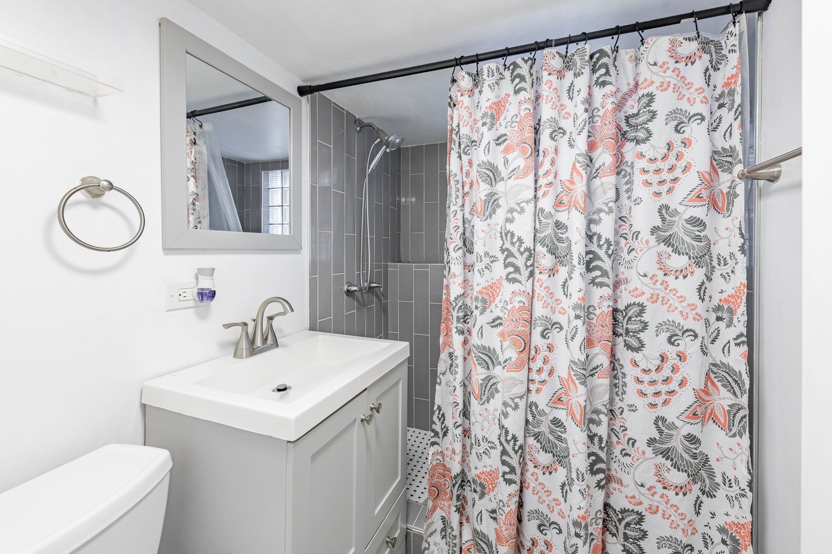 5026 West Addison Street Chicago, IL 60641 - Photo 26 of 34 a bathroom with a sink and a mirror