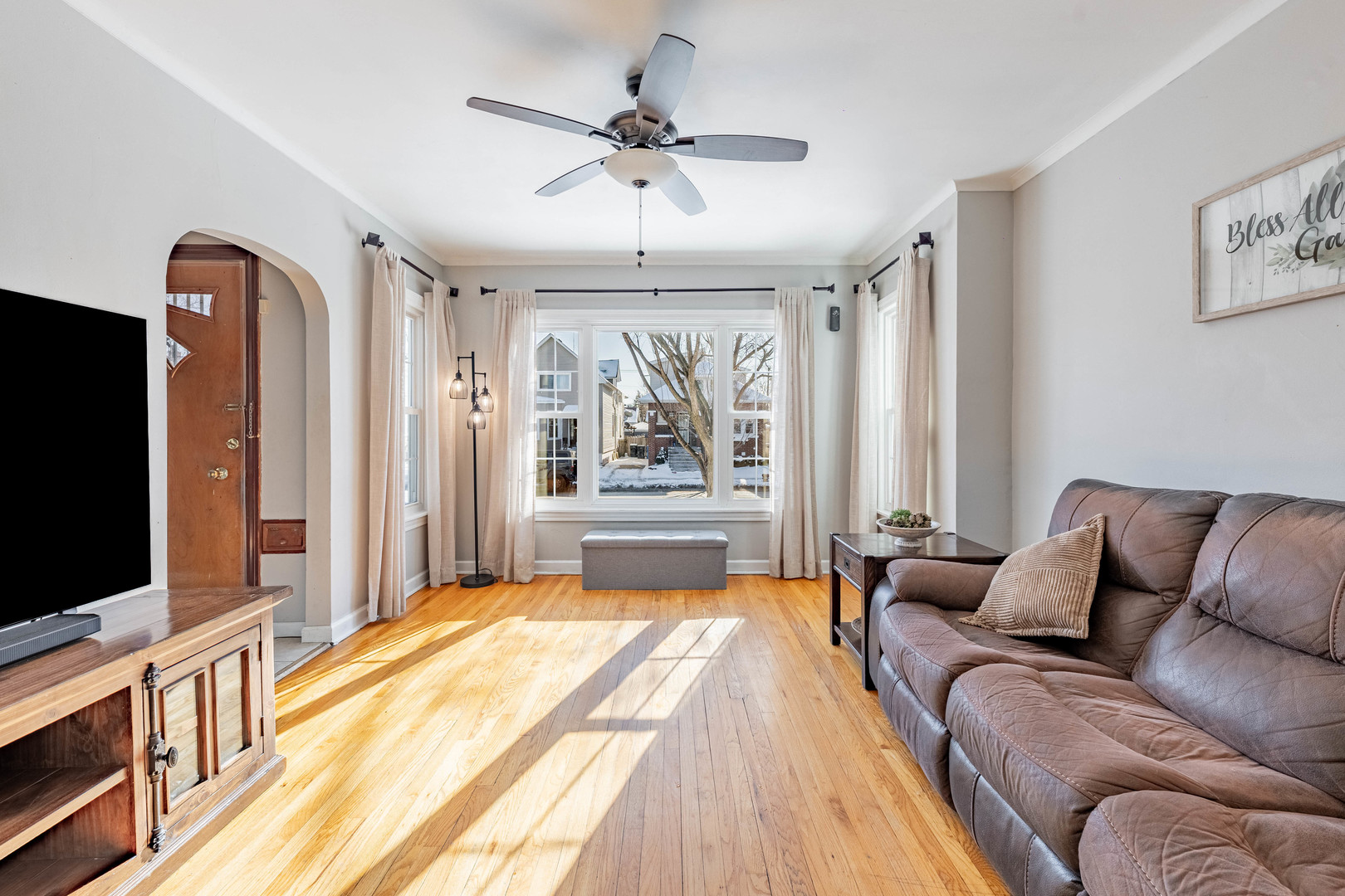 5026 West Addison Street Chicago, IL 60641 - Photo 3 of 34 a living room with furniture and a flat screen tv