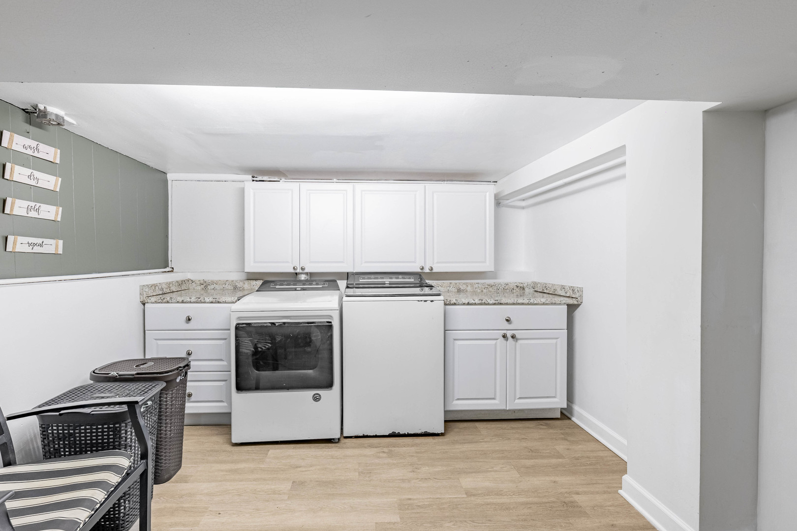 5026 West Addison Street Chicago, IL 60641 - Photo 31 of 34 a kitchen with white cabinets and white appliances
