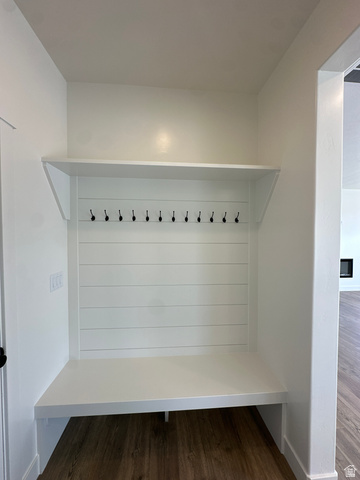 1225 West 500 South Logan, UT 84321 - Photo 21 of 39 Built-in white mudroom bench featuring a shiplap back panel, upper shelf, and multiple black coat hooks
