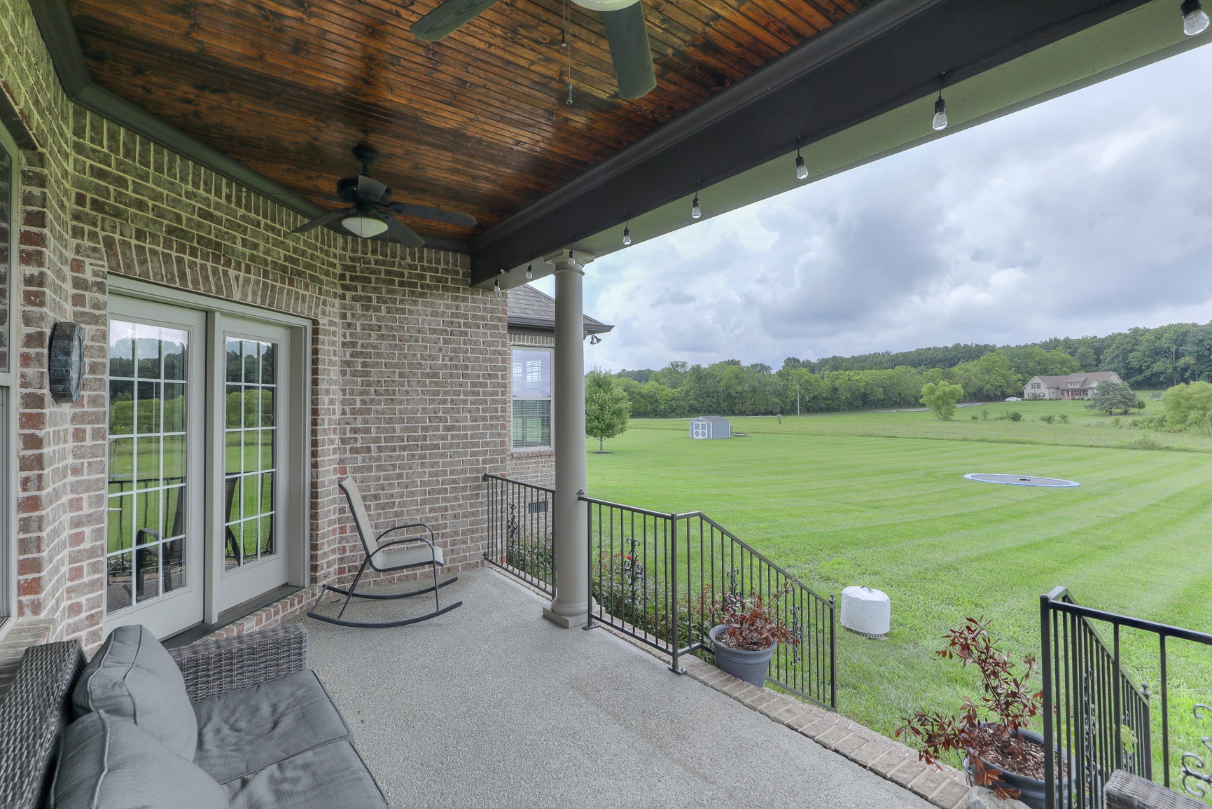 2152 Holloway Road Lebanon, TN 37090 - Photo 5 of 44 a view of a porch with a table chairs and a yard