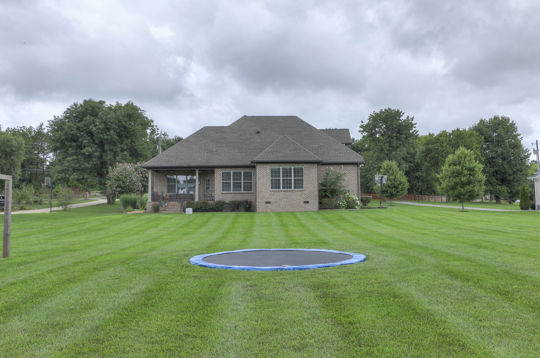 2152 Holloway Road Lebanon, TN 37090 - Photo 7 of 44 a view of a big yard with a house in the background