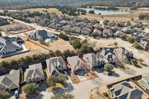 a dining room with furniture and a potted plant