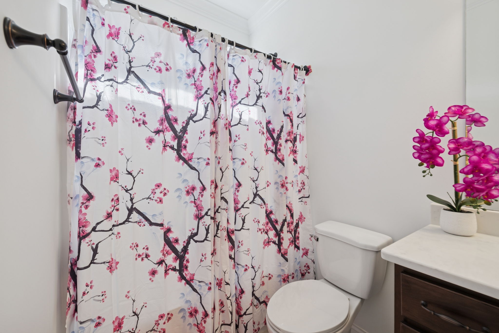 926 Monteagle Falls Road Monteagle, TN 37356 - Photo 16 of 30 a white toilet sitting next to a shower curtain