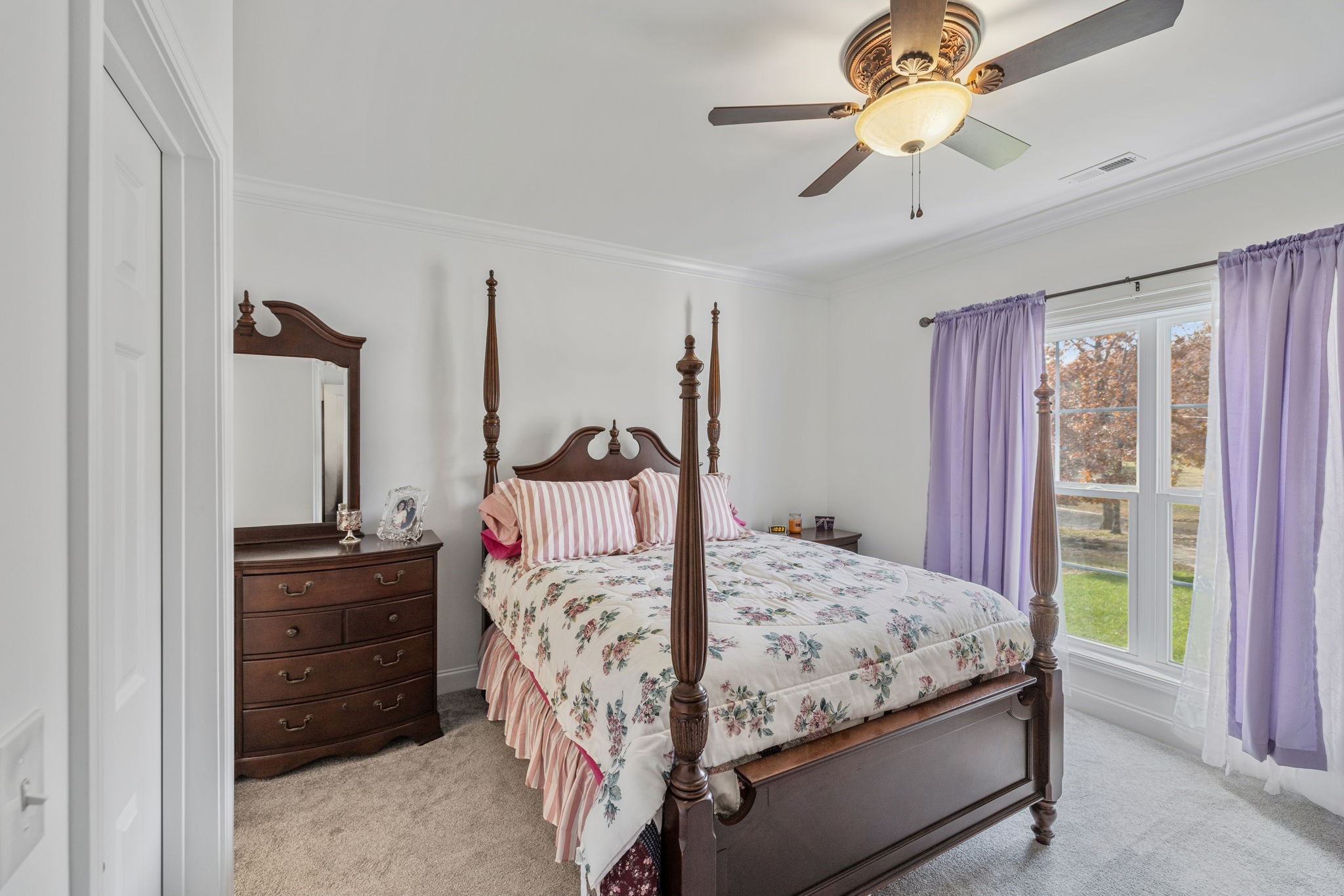 926 Monteagle Falls Road Monteagle, TN 37356 - Photo 17 of 30 a bedroom with a bed and a chandelier