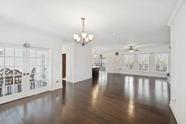 a view of a livingroom with a ceiling fan and window