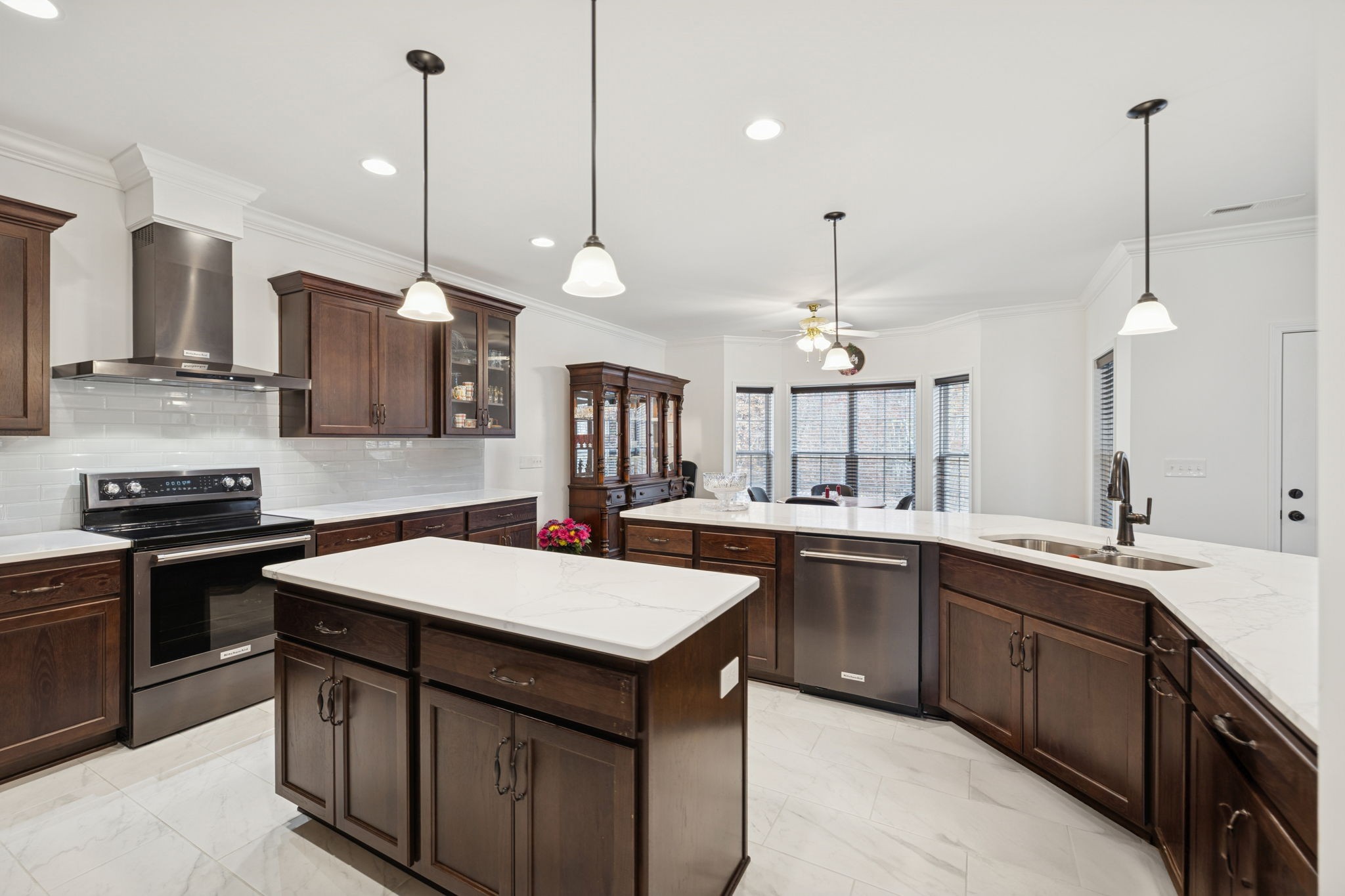 926 Monteagle Falls Road Monteagle, TN 37356 - Photo 8 of 30 a kitchen with kitchen island granite countertop a sink a stove and a wooden floors