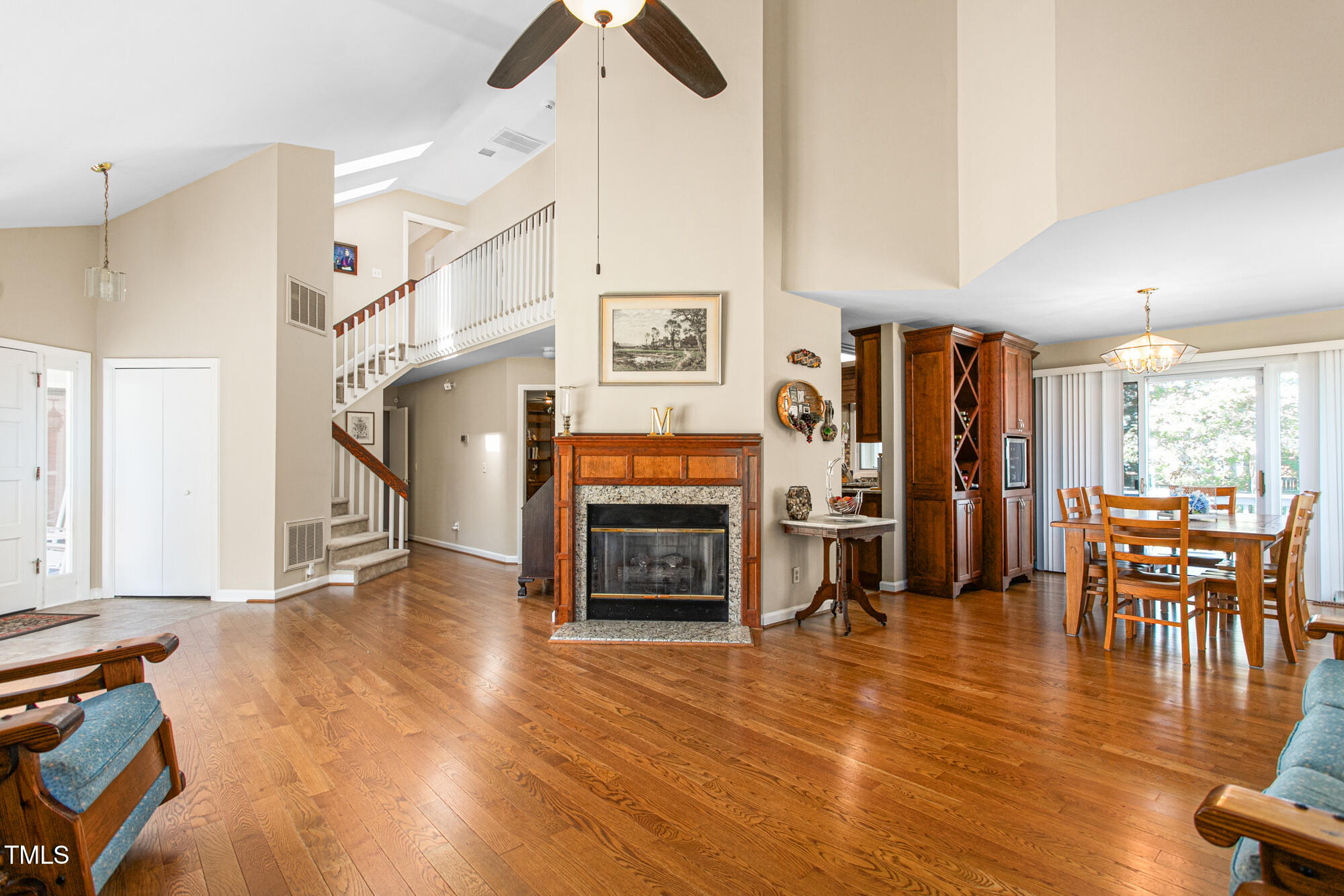 809 Brookview Drive Elon, NC 27244 - Photo 7 of 53 a living room with furniture wooden floor and a fireplace