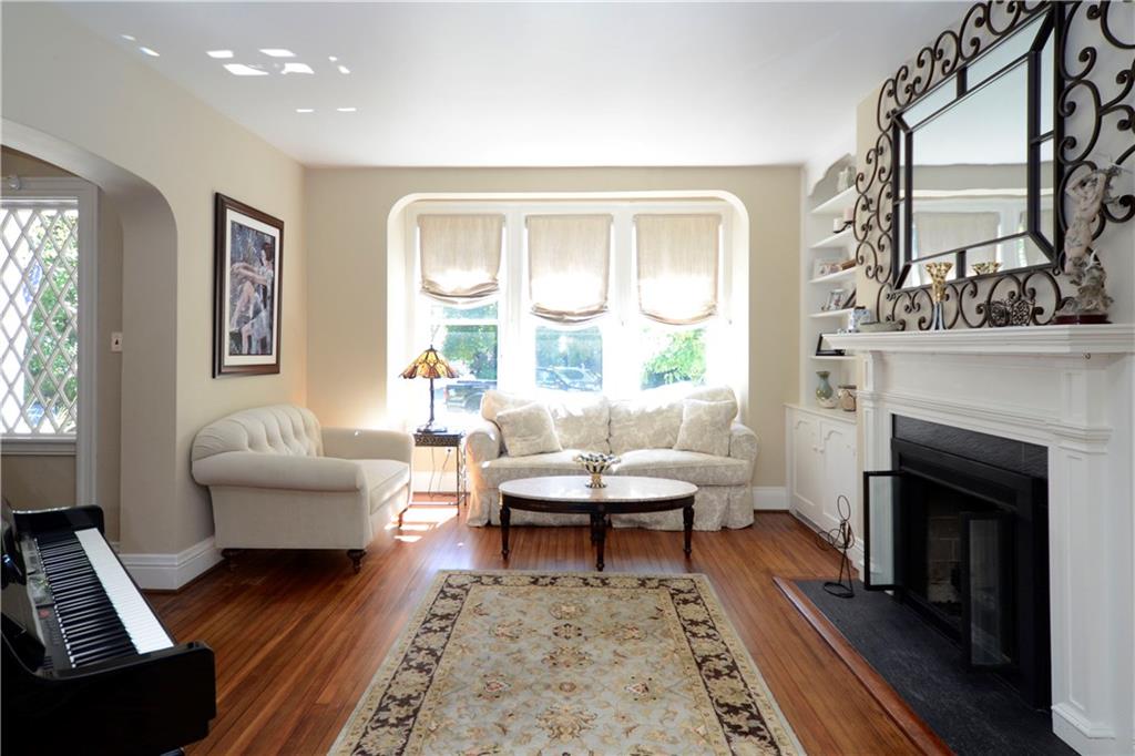309 Quaker Road Sewickley, PA 15143 - Photo 5 of 25 The living room, with working fireplace, is large enough for your baby grand!