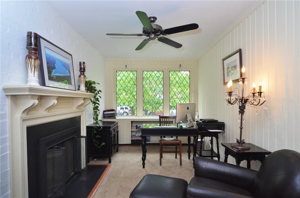 309 Quaker Road Sewickley, PA 15143 - Photo 7 of 25 The main level den with working fireplace is an aded bonus.