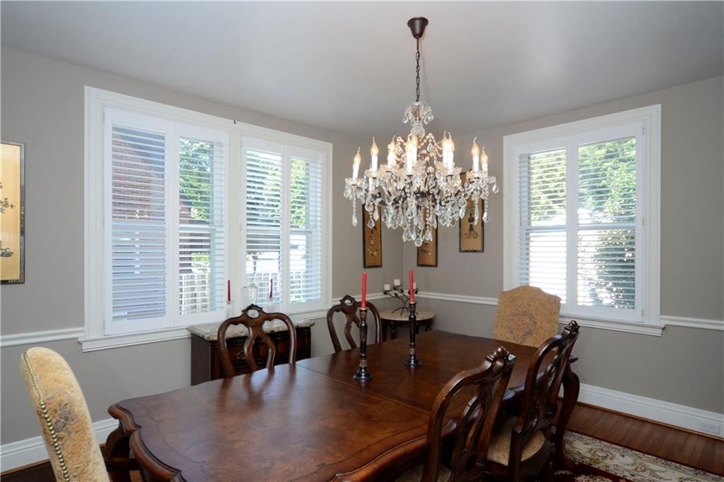 309 Quaker Road Sewickley, PA 15143 - Photo 10 of 25 Light and bright, the dining room features wood floors an chandler lighting.