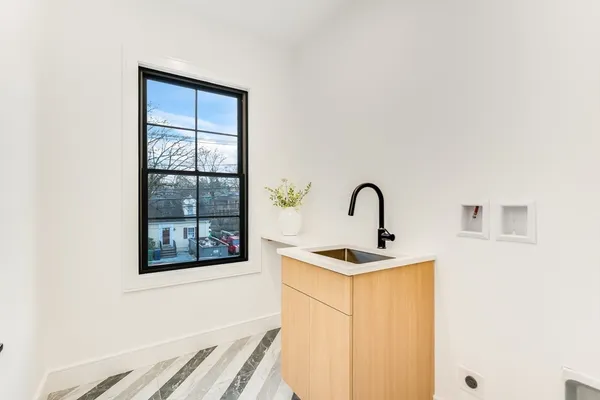 a close view of a sink and a microwave