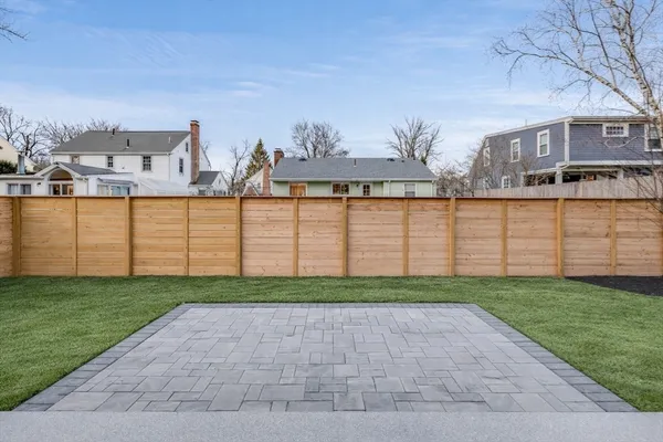 a view of a house with backyard and garden