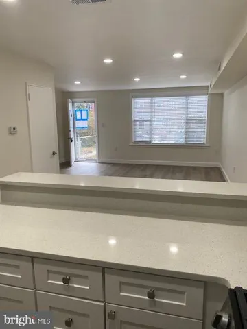 a bathroom with a bathtub and a window