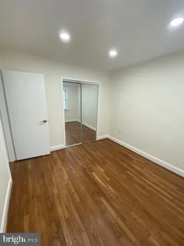 an empty room with wooden floor