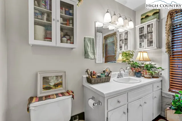a kitchen with a sink cabinets and window