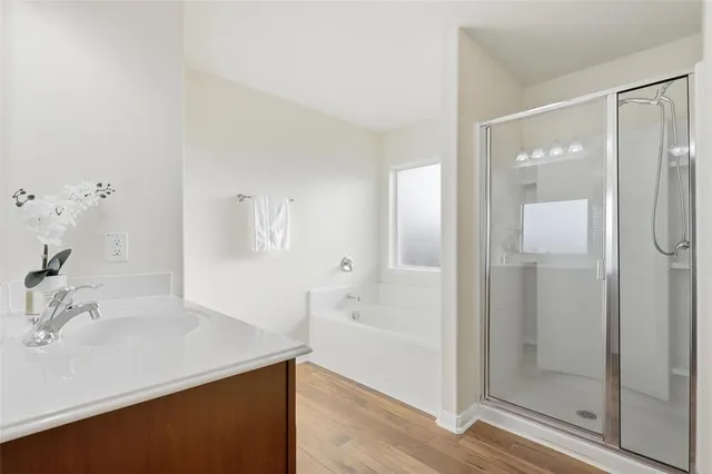 a bathroom with a bathtub and a sink