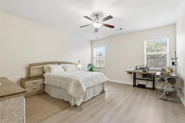 a bedroom with bed and window