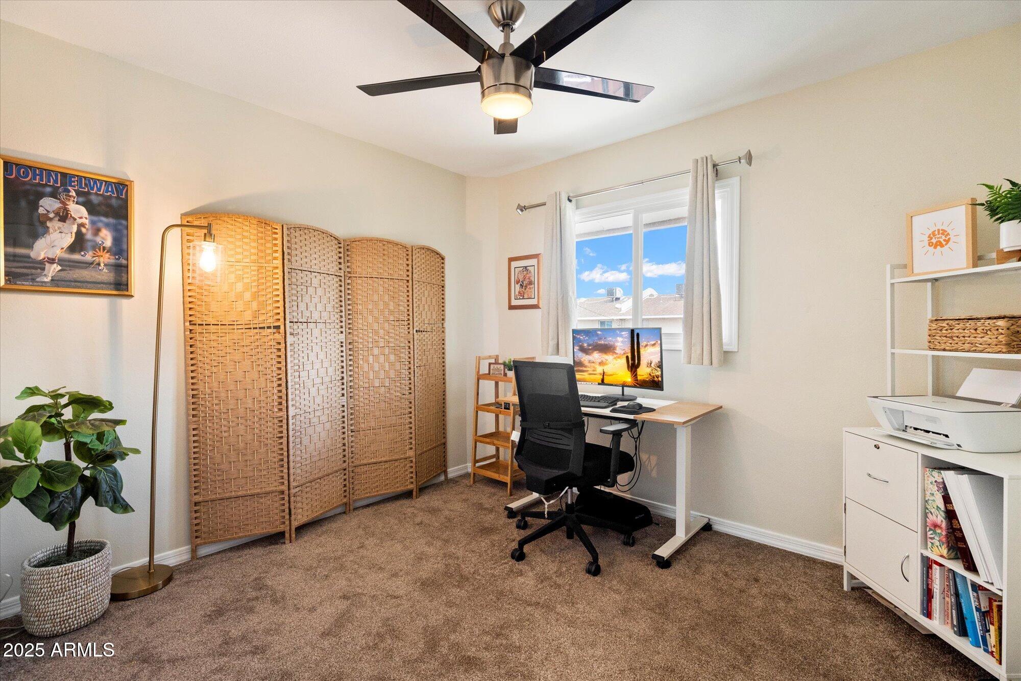 6005 North Granite Reef Road Scottsdale, AZ 85250 - Photo 11 of 19 a view of a workspace with furniture and a window
