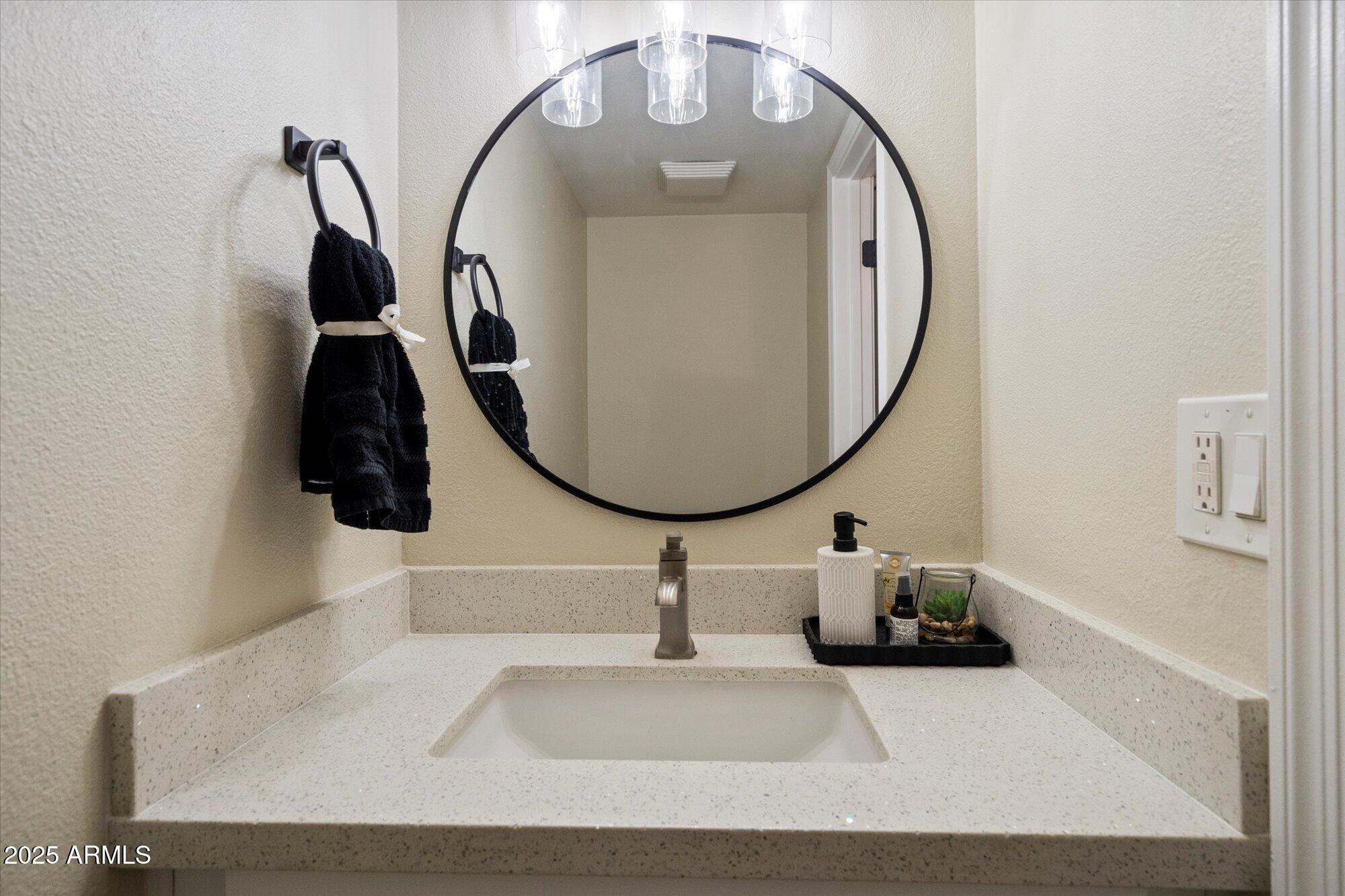 6005 North Granite Reef Road Scottsdale, AZ 85250 - Photo 12 of 19 a picture of a bathroom with sink and mirror