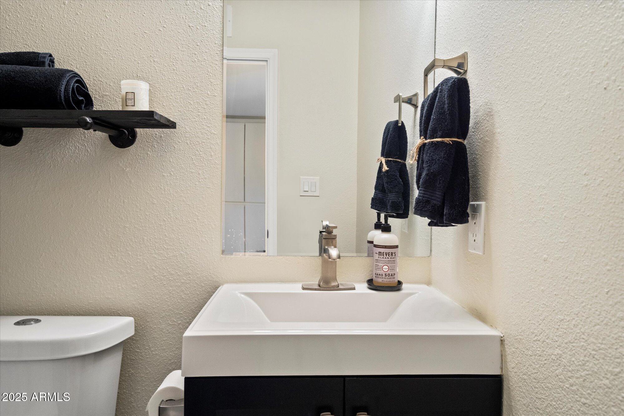 6005 North Granite Reef Road Scottsdale, AZ 85250 - Photo 10 of 19 a bathroom with a sink and a mirror