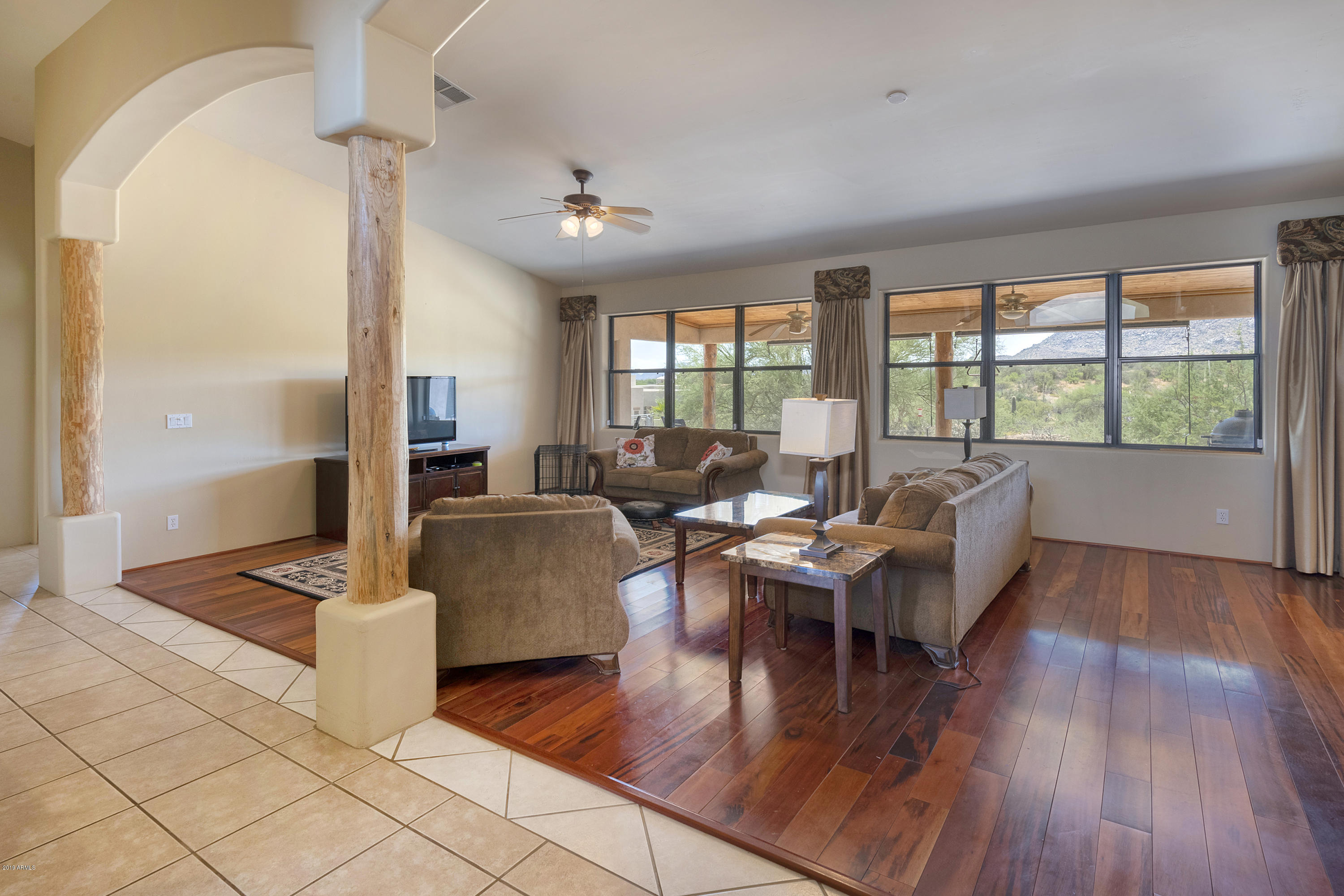 13849 East Hawknest Road Scottsdale, AZ 85262 - Photo 16 of 52 a living room with furniture and wooden floor