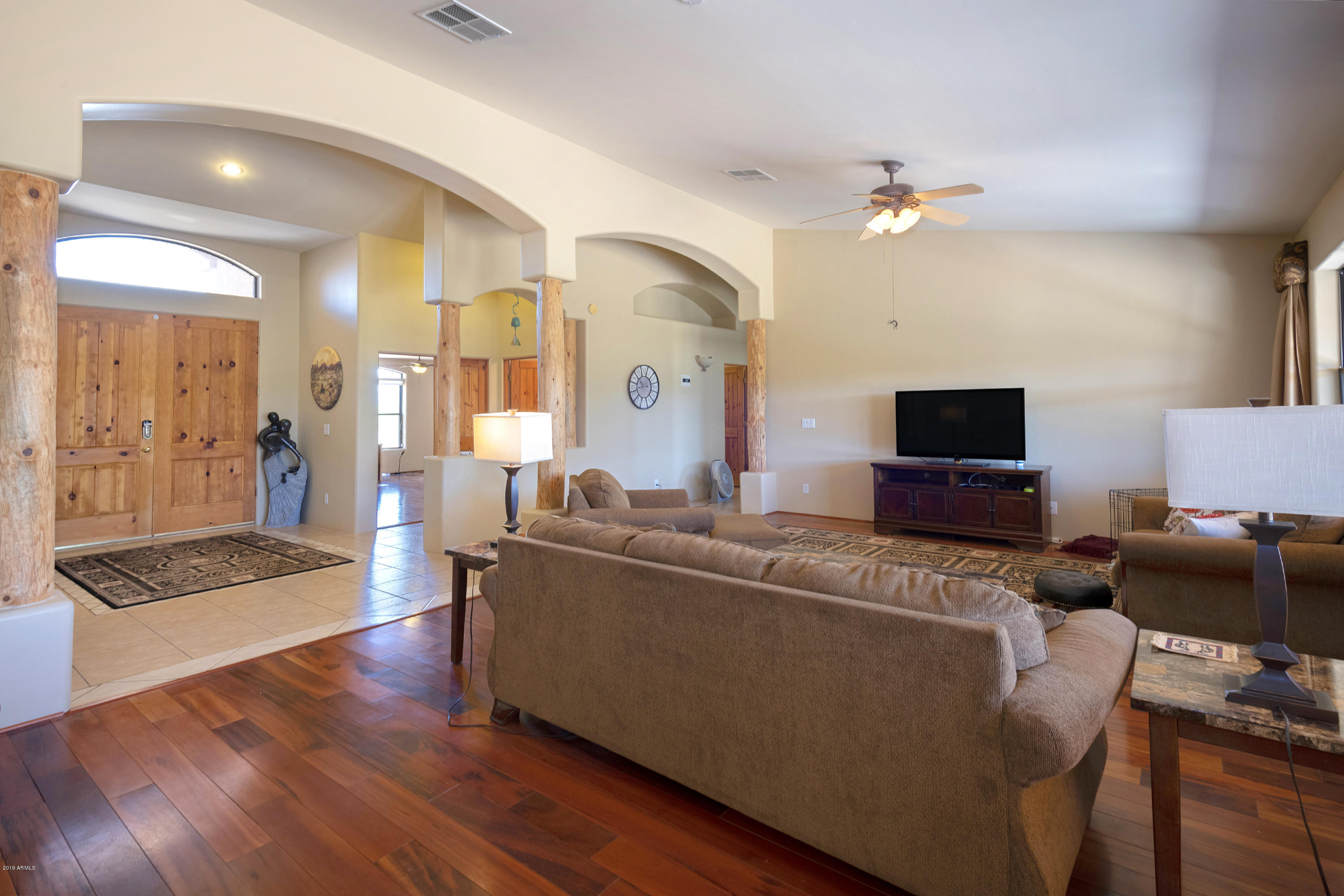 13849 East Hawknest Road Scottsdale, AZ 85262 - Photo 17 of 52 a living room with furniture and a flat screen tv