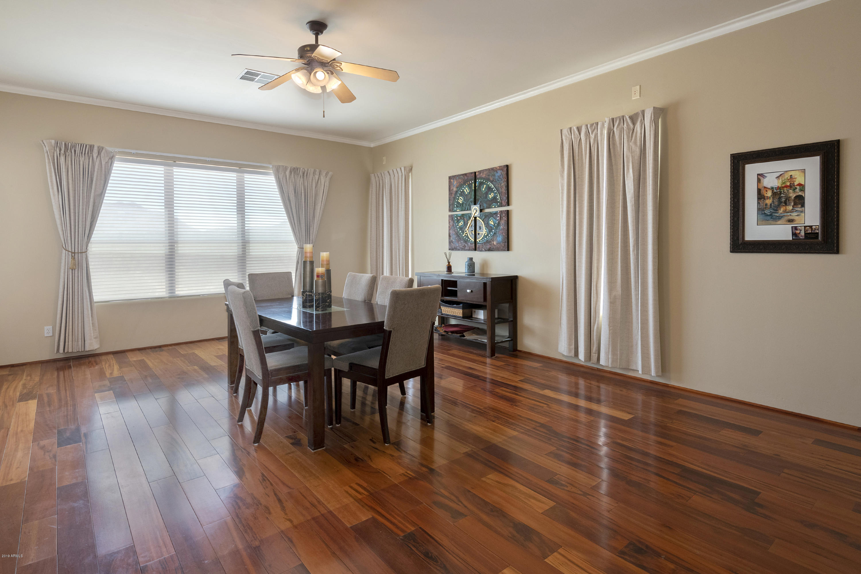 13849 East Hawknest Road Scottsdale, AZ 85262 - Photo 21 of 52 a view of a dining room with furniture window and wooden floor