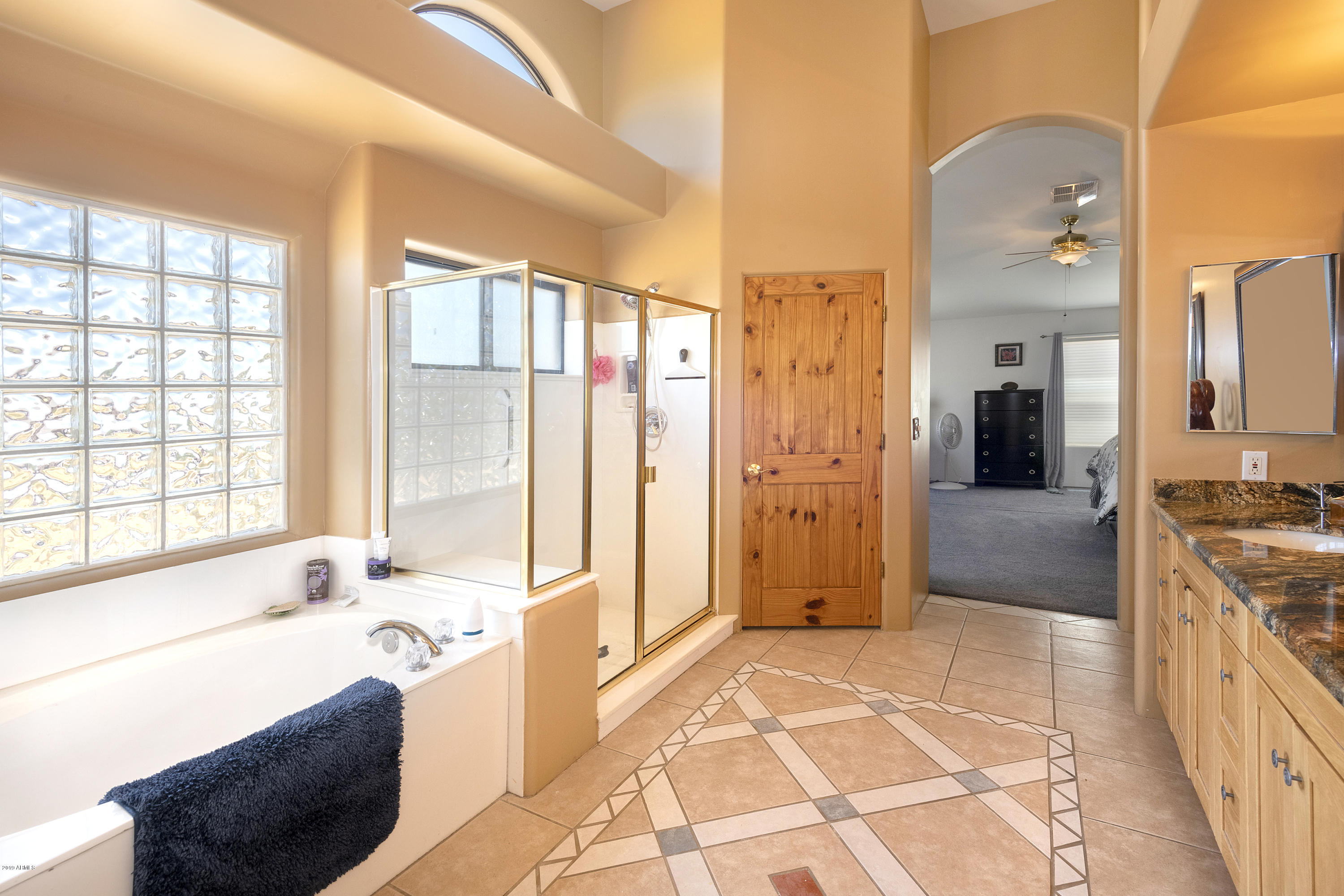 13849 East Hawknest Road Scottsdale, AZ 85262 - Photo 24 of 52 a spacious bathroom with a tub sink and mirror