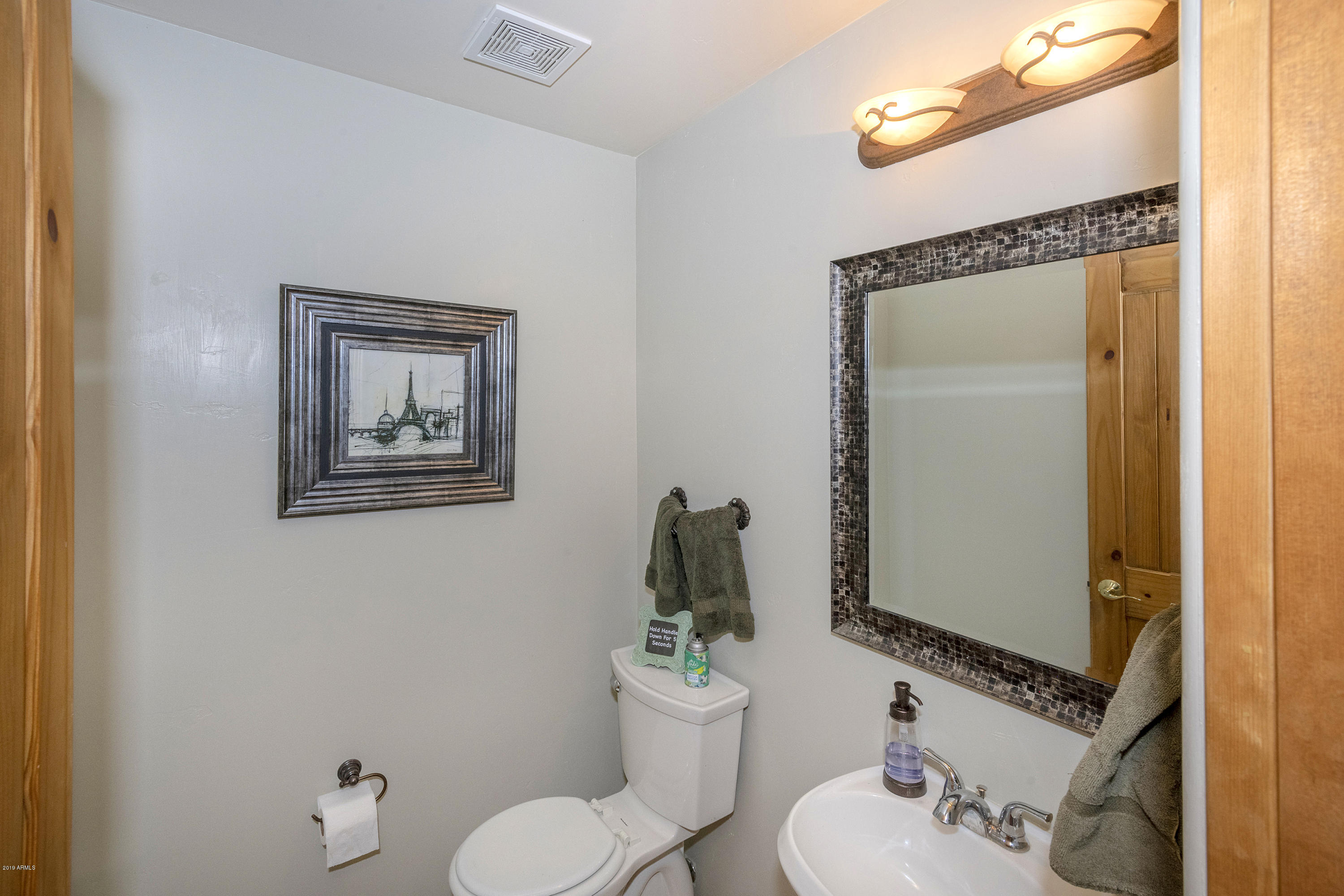 13849 East Hawknest Road Scottsdale, AZ 85262 - Photo 30 of 52 a bathroom with a sink mirror and toilet