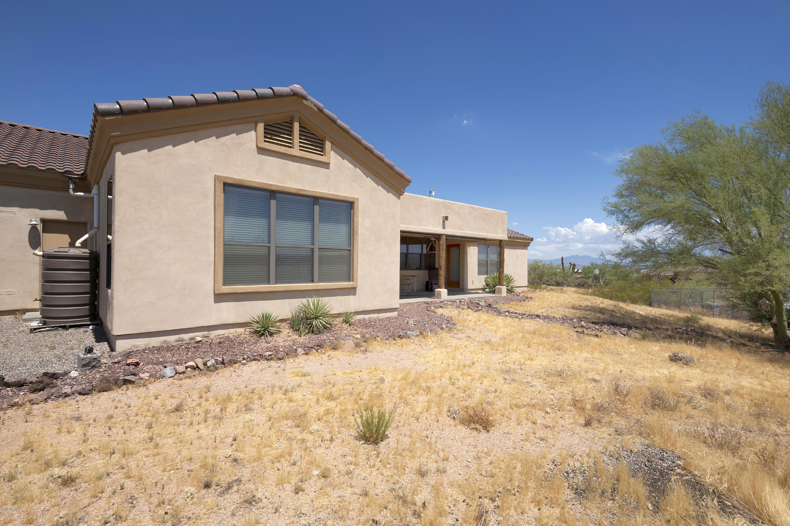 13849 East Hawknest Road Scottsdale, AZ 85262 - Photo 41 of 52 a front view of a house with a yard