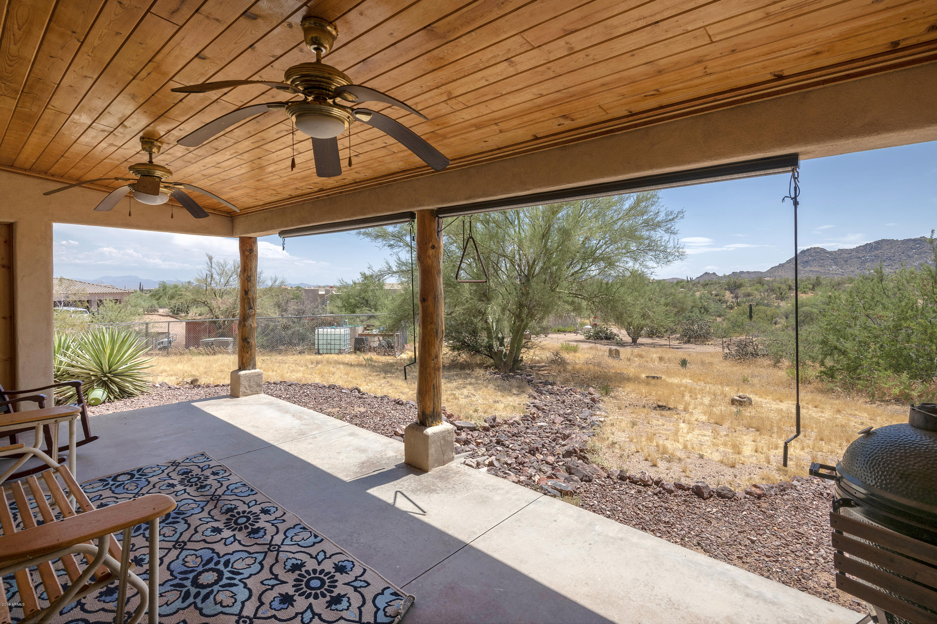 13849 East Hawknest Road Scottsdale, AZ 85262 - Photo 8 of 52 a view of a porch with furniture and backyard