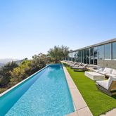 a view of swimming pool with lounge chair